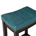 Teal padded seat top with nailhead trim on Crowell counter stool
