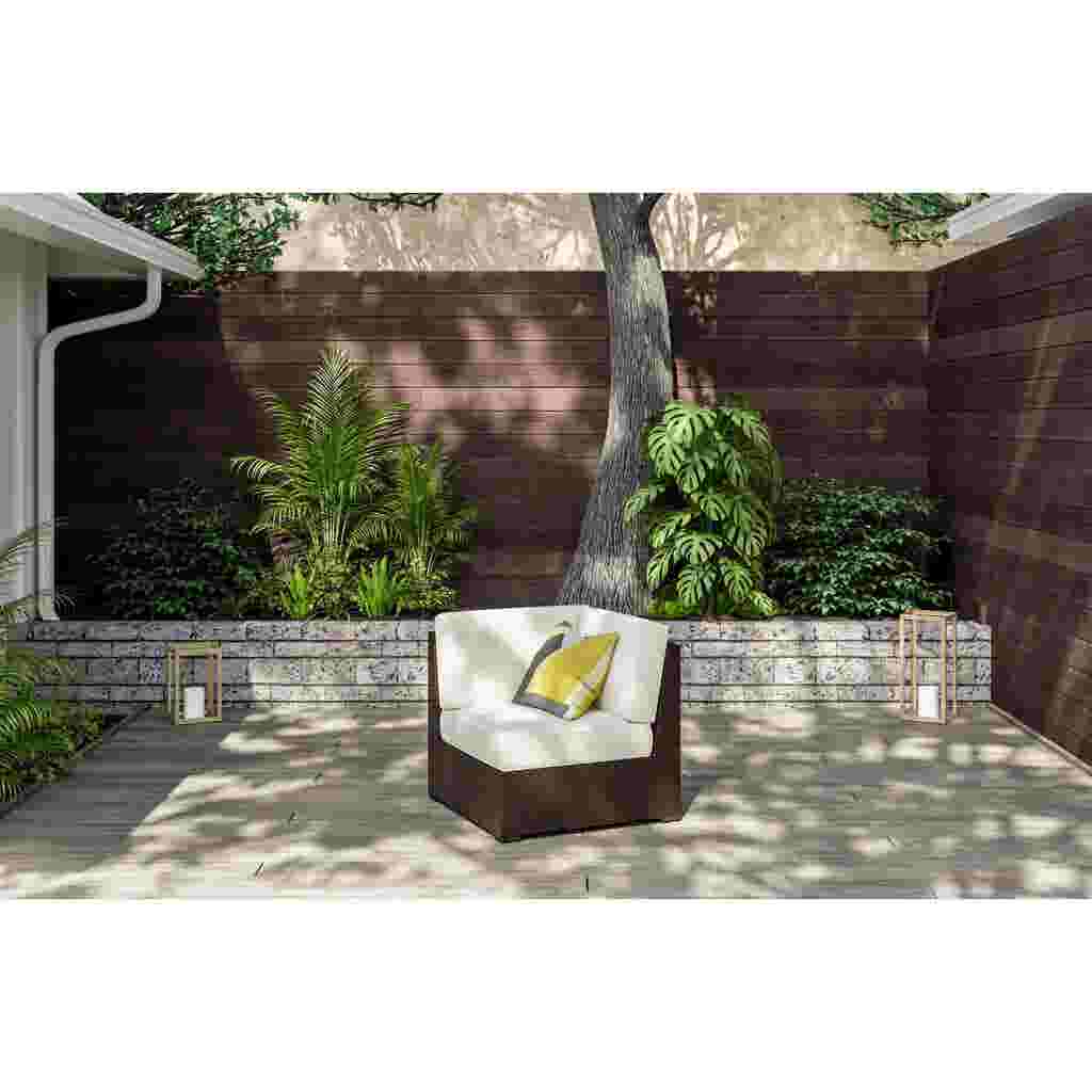 Outdoor sectional side chair with white cushions in a patio setting with plants and a table