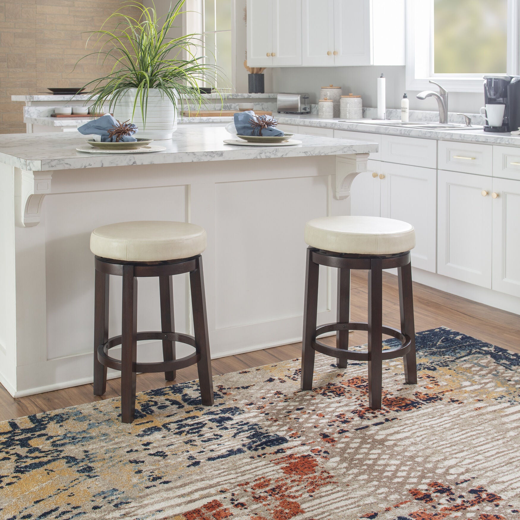 Two Maya counter stools around a kitchen counter
