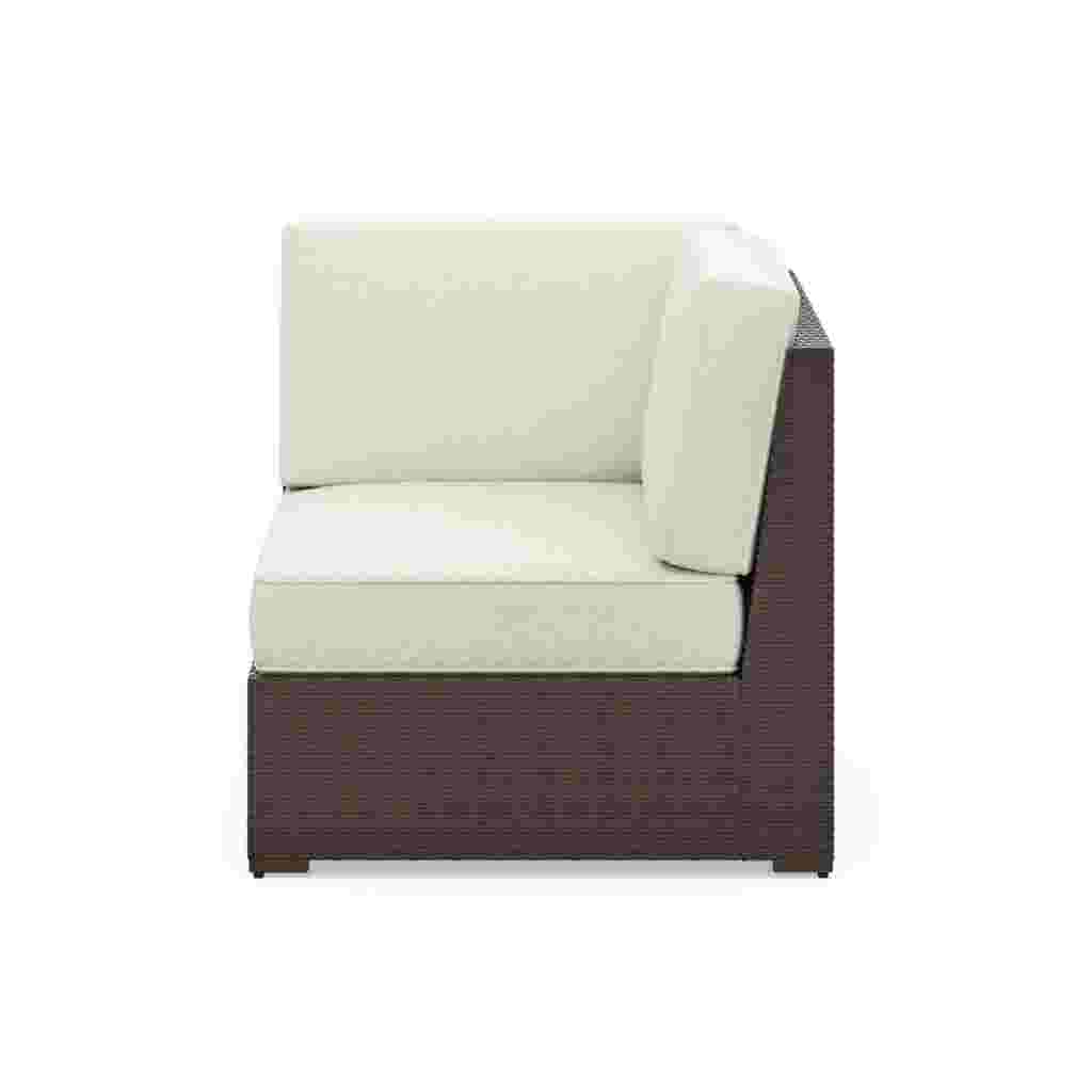 White cushioned outdoor sectional side chair with dark brown wicker frame
