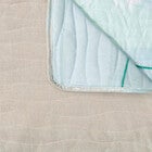 Light blue quilted furniture protector fabric detail