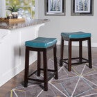 Crowell blue counter stool in a kitchen setting with dark wood frame