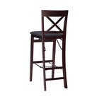 Two bar stools with X-back design in a close grouping.