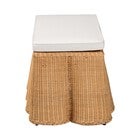 Side view of natural rattan rectangle ottoman with white cushion
