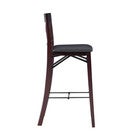 Side profile of bar stool showing curved wooden leg and cushioned seat.