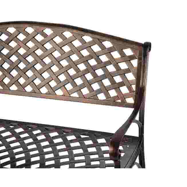 Close-up of the lattice back and armrest of the antique bronze patio bench