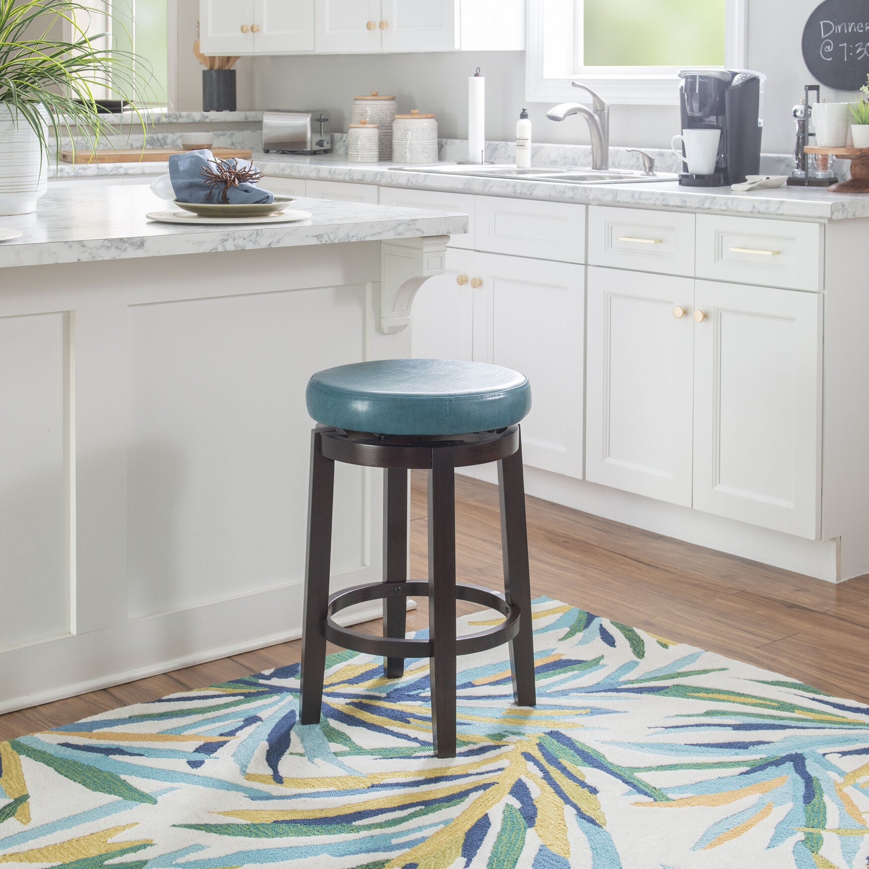 Maya counter stool in a kitchen with patterned flooring