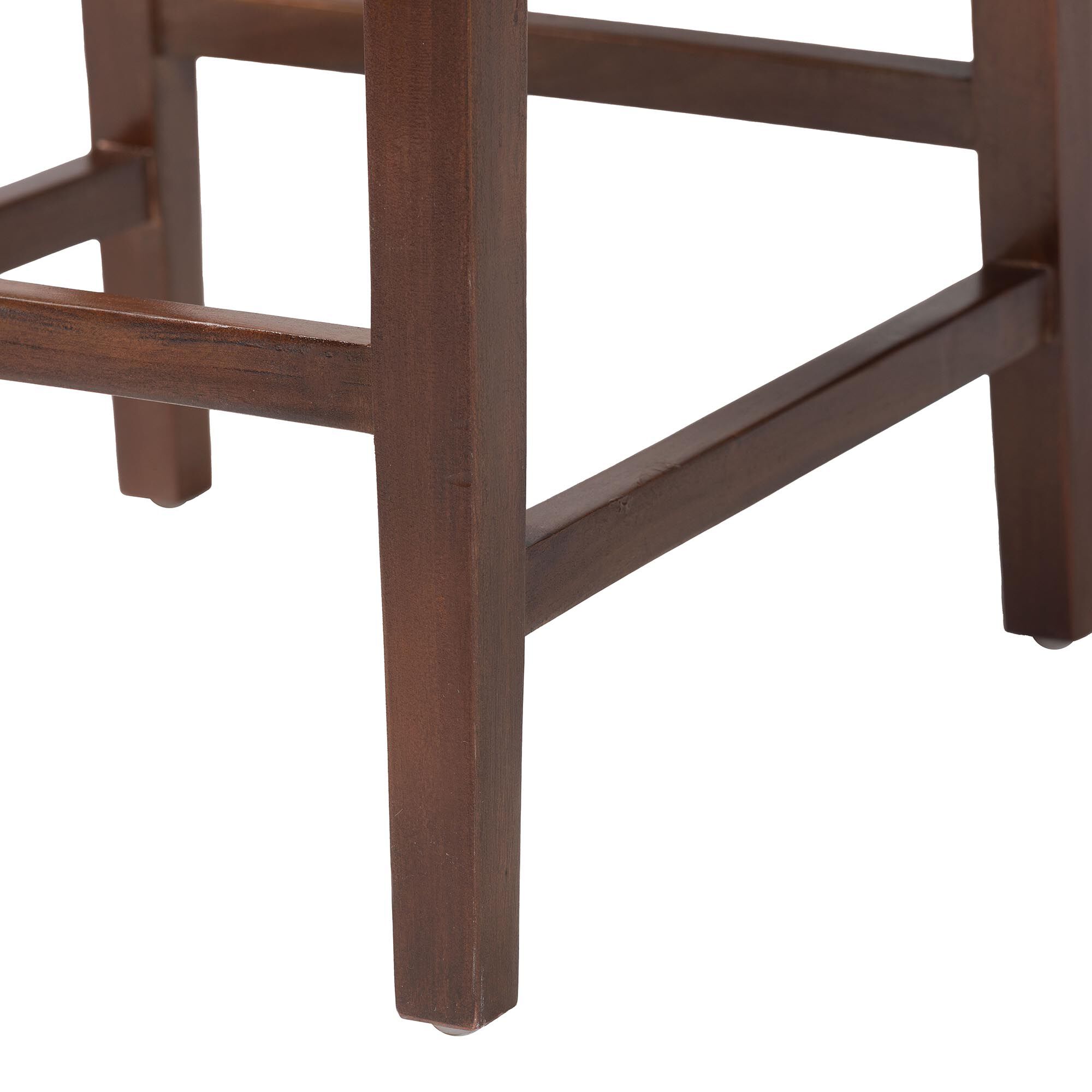 Close-up of wooden leg and footrest of bar stool