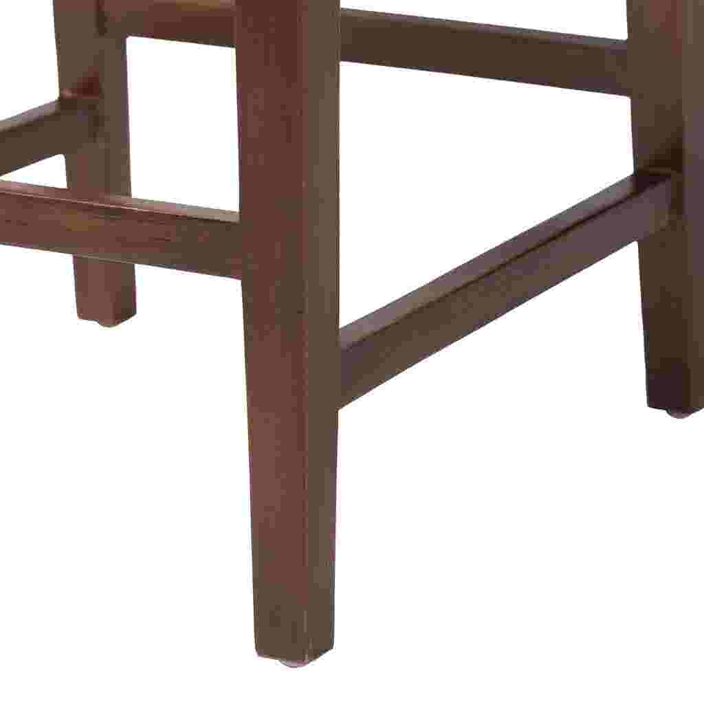 Close-up of wooden leg and footrest of bar stool