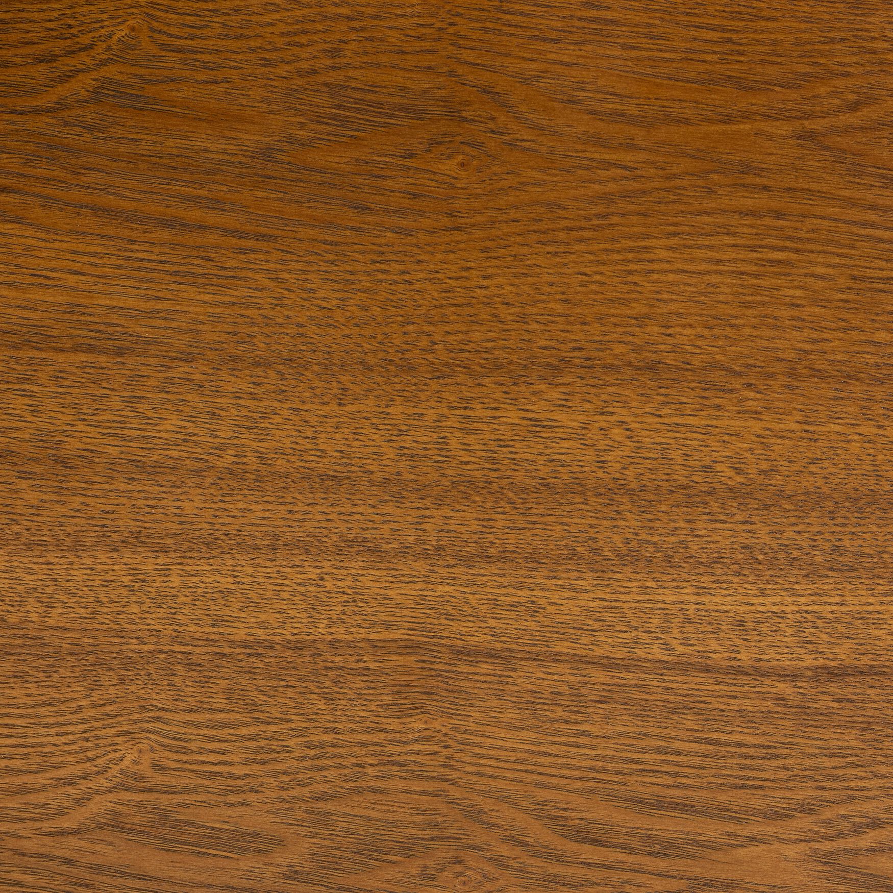 Close-up of the natural brown wood grain surface of the coffee table.