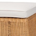 Close-up of white cushion on natural rattan ottoman