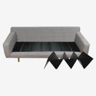 A gray sofa with a black expandable cushion/cover extending from the bottom right toward the center